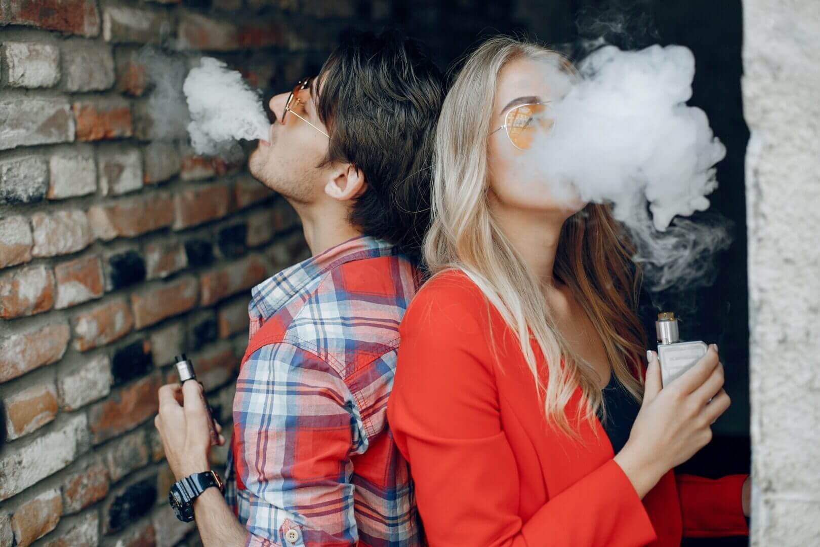 A girl spends time with friends and smokes scaled